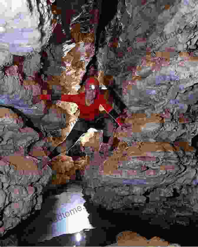 A Caver Exploring A Narrow Cave Passage The Longest Cave Roger W Brucker